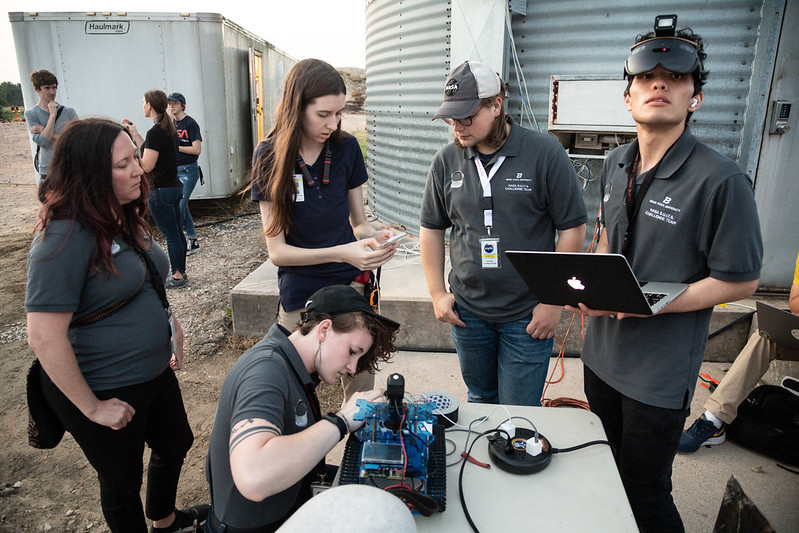 Team preparing equipment for live testing at Johnson Space Center